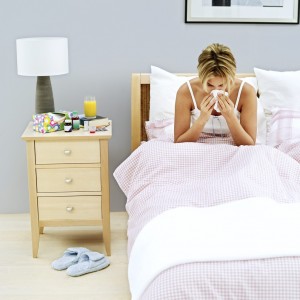 Woman sick in bed